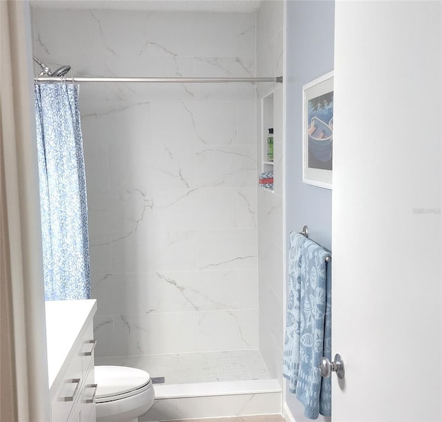 bathroom with toilet, a shower with shower curtain, and vanity