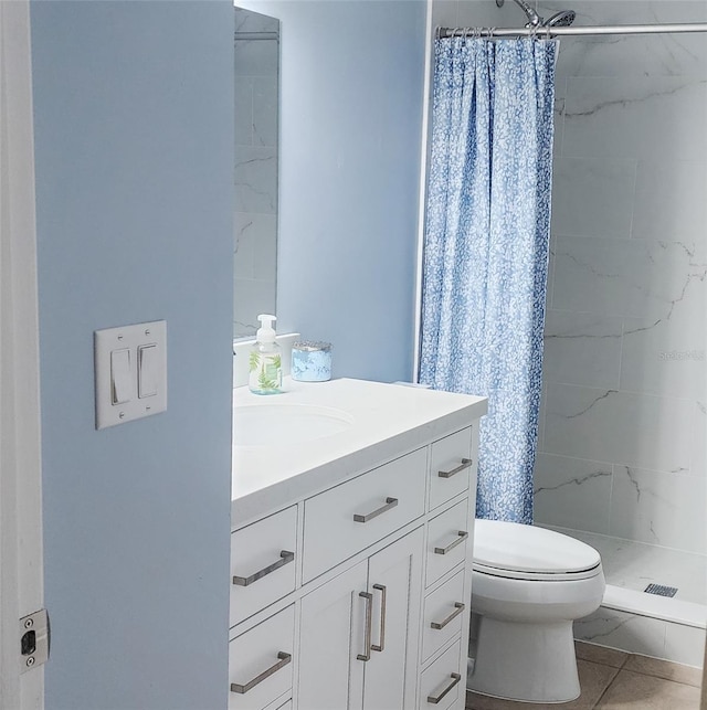 bathroom with toilet, tile patterned flooring, vanity, and a shower with shower curtain