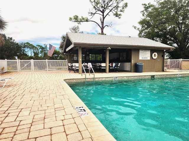 view of swimming pool featuring a patio