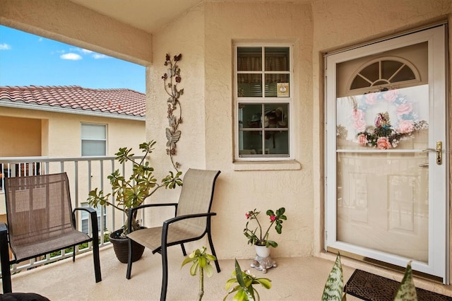 entrance to property with a balcony