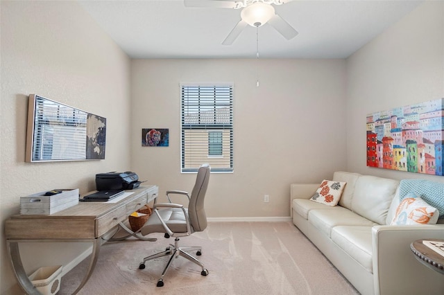 office area with ceiling fan and light colored carpet