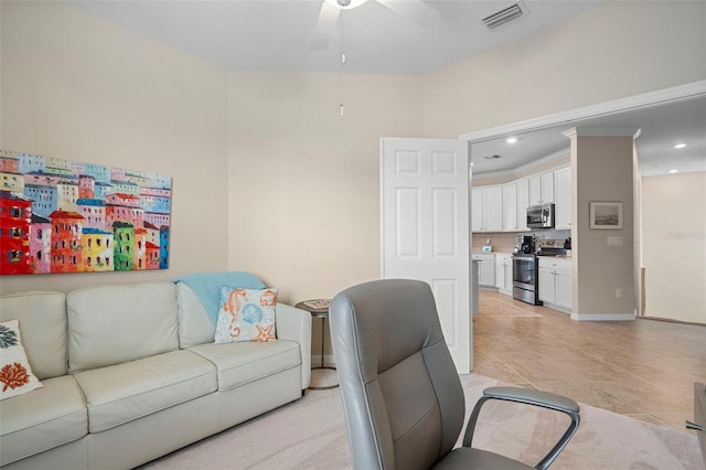 tiled living room featuring ceiling fan