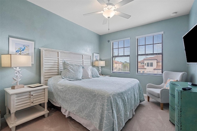 bedroom featuring light colored carpet and ceiling fan