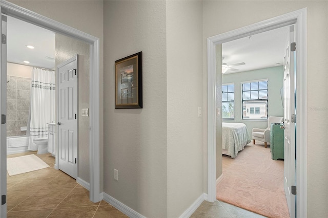 hall with light tile patterned flooring