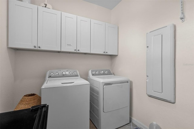 laundry area with cabinets and washing machine and clothes dryer