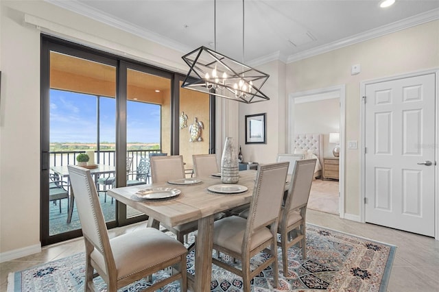 tiled dining space featuring crown molding and an inviting chandelier