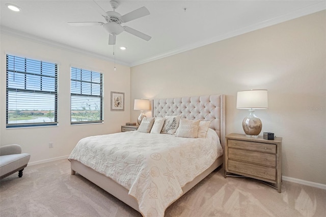 bedroom featuring ornamental molding, light carpet, and ceiling fan