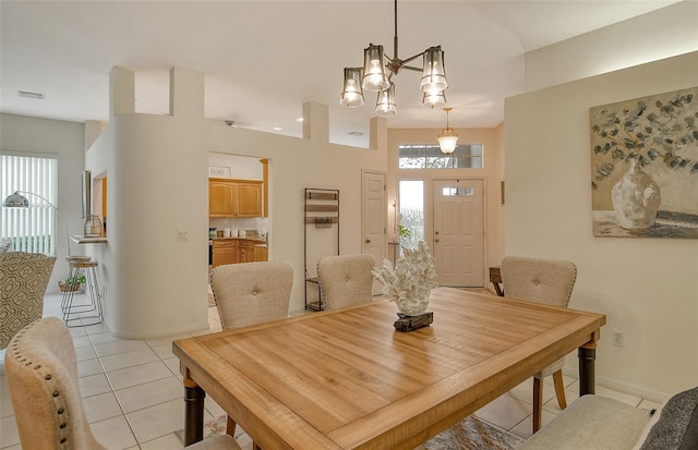 tiled dining room with a healthy amount of sunlight