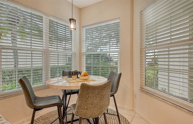 dining area with light tile patterned floors