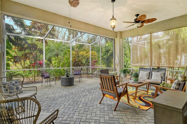 sunroom / solarium with ceiling fan