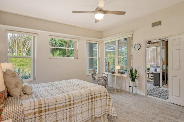 bedroom with ceiling fan and carpet