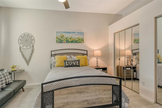 bedroom with light colored carpet, a closet, and ceiling fan