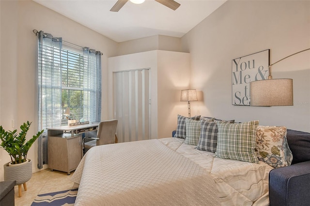 bedroom with ceiling fan and light tile patterned floors