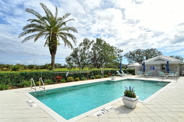 view of pool featuring a patio area