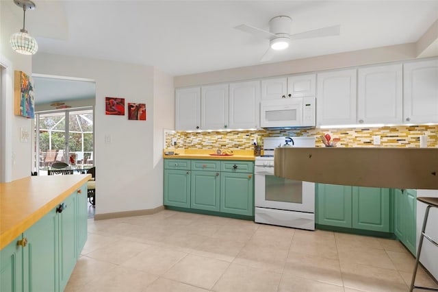 kitchen with white appliances, white cabinets, decorative light fixtures, backsplash, and light tile patterned floors