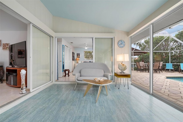 sitting room with lofted ceiling