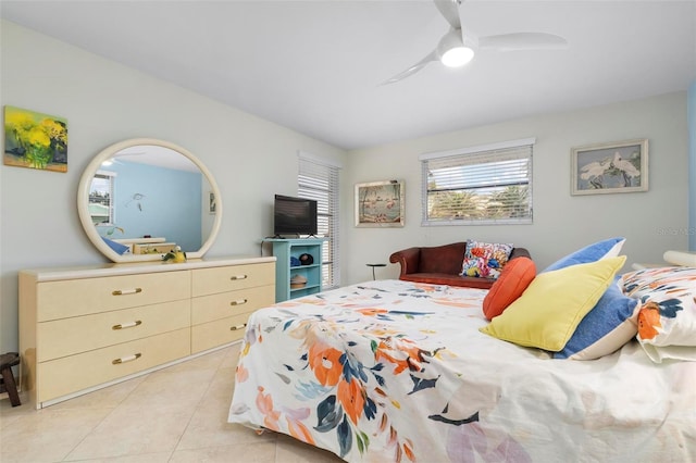 tiled bedroom with ceiling fan