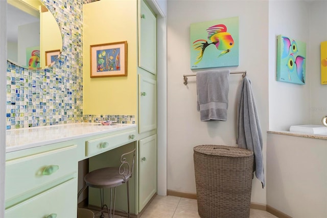 bathroom featuring vanity, backsplash, and tile patterned floors