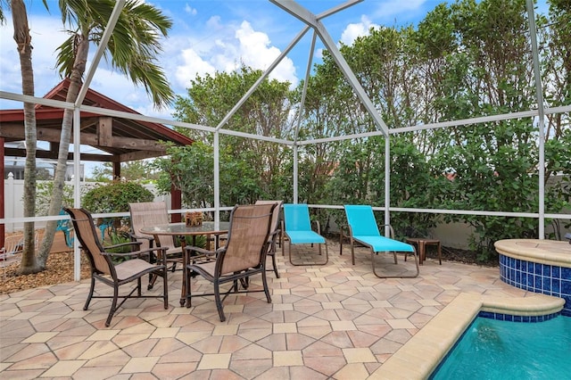 view of patio featuring a lanai