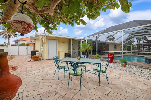 view of patio with glass enclosure