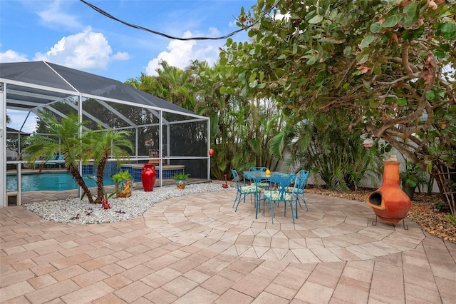 view of patio with glass enclosure