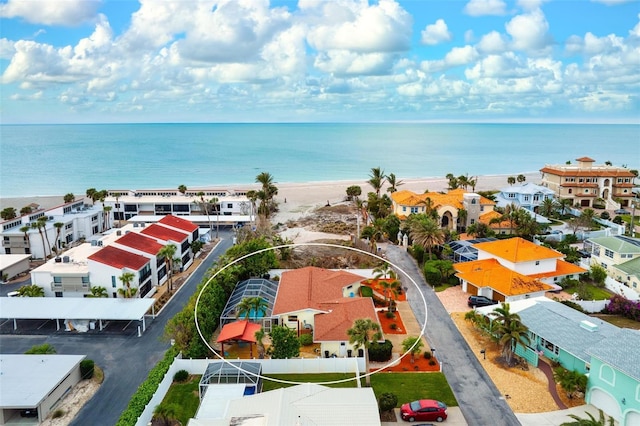 bird's eye view featuring a water view and a view of the beach