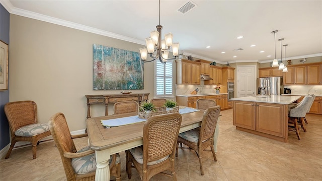 dining area with an inviting chandelier, ornamental molding, and light tile patterned flooring