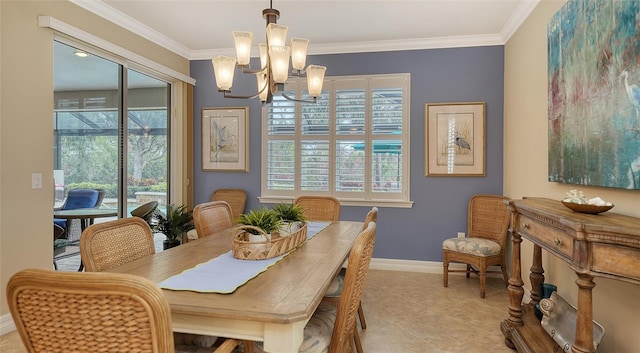 dining space featuring ornamental molding and a notable chandelier