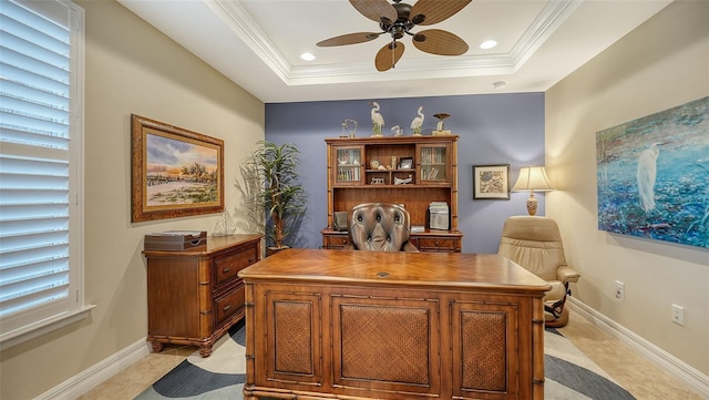 office area featuring a raised ceiling, crown molding, and ceiling fan