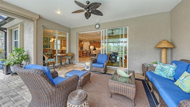 view of patio / terrace with ceiling fan and an outdoor living space