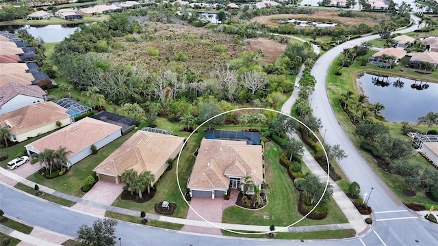 bird's eye view with a water view