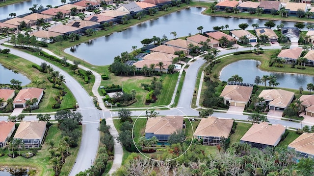 bird's eye view with a water view