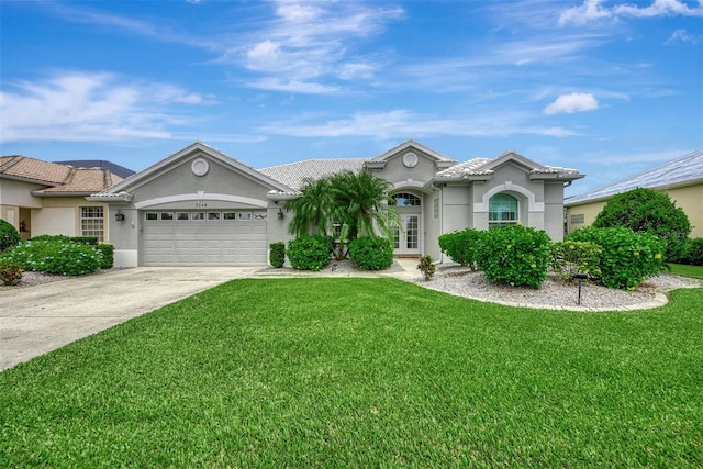 single story home featuring a front yard and a garage