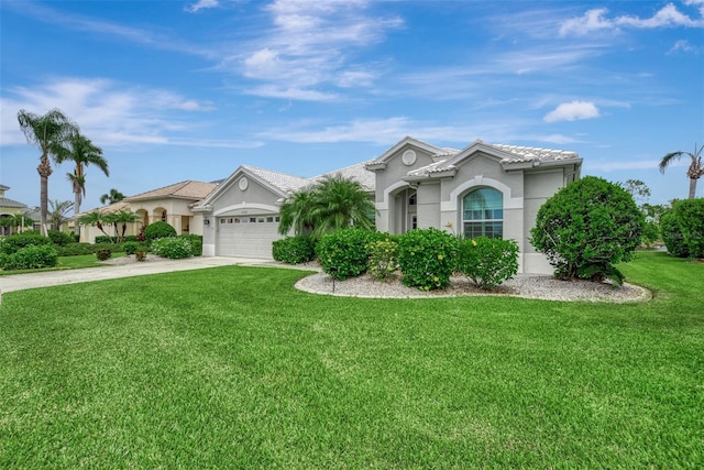 view of front of house with a front lawn and a garage