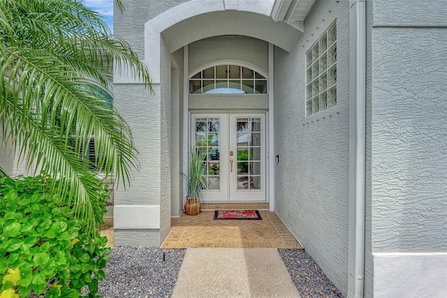 entrance to property featuring french doors