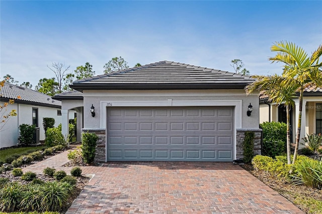 view of front of property with a garage