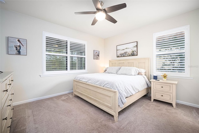 bedroom with light carpet and ceiling fan