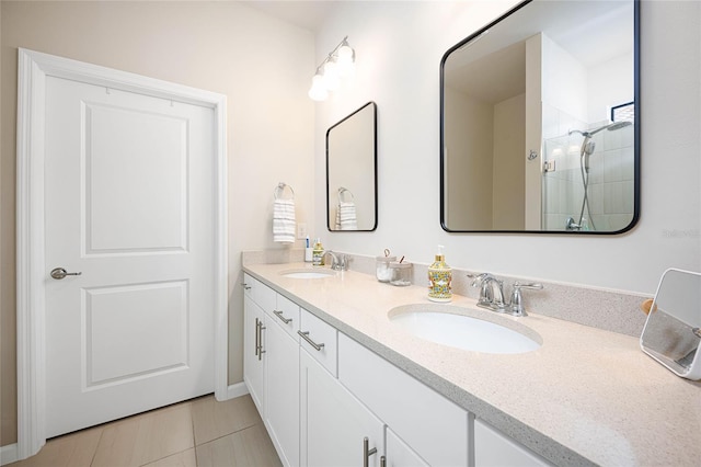 bathroom with vanity and a shower