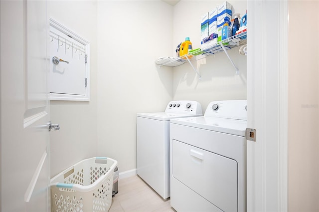 clothes washing area featuring washing machine and clothes dryer