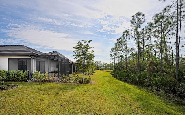 view of yard with a lanai