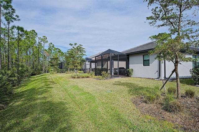 view of yard with a lanai