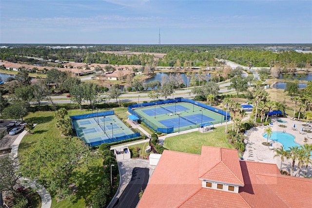 birds eye view of property with a water view