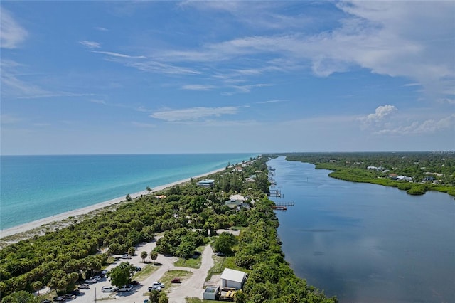 bird's eye view with a water view and a beach view