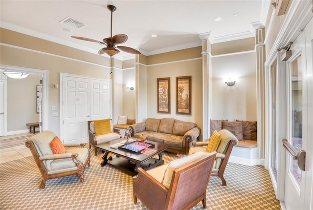 living room with ornamental molding and ceiling fan