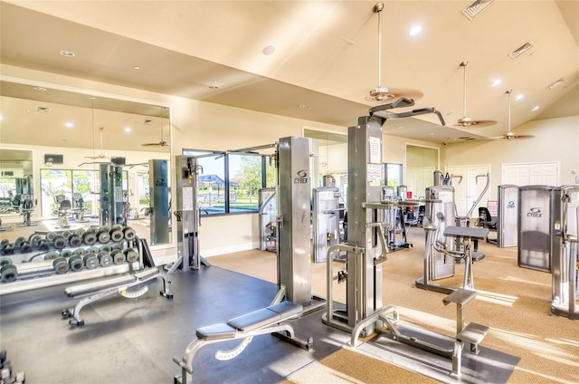 gym with lofted ceiling and ceiling fan