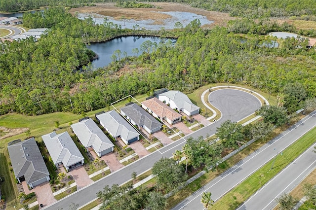 birds eye view of property with a water view