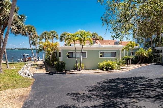 view of front of home featuring a water view