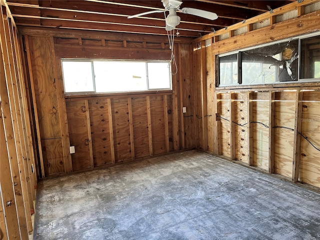 interior space with ceiling fan