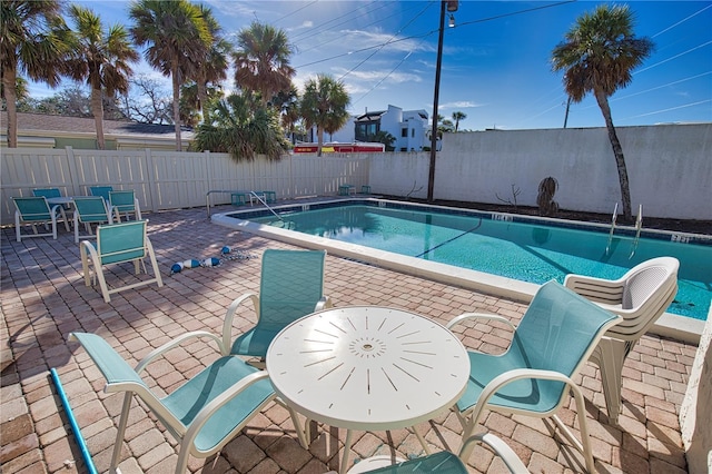 view of swimming pool featuring a patio area