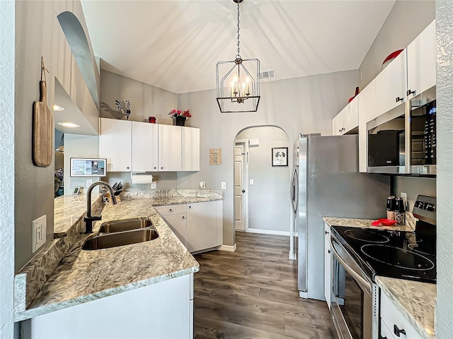 kitchen featuring pendant lighting, sink, stainless steel appliances, dark hardwood / wood-style floors, and white cabinets